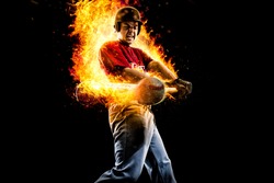 baseball player in fire hit a flying ball. isolated on black background