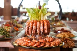 Steamed shrimp, seafood dishes are very delicious. National dishes on the table