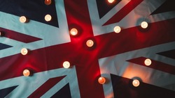Mourning candles on Queen flag of England