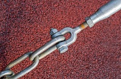 Thimble shackle turnbuckle connection, metal ring and rope, corroded threads, close-up view