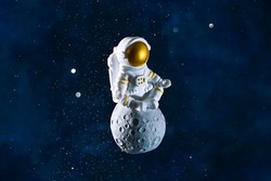 abstract composition astronaut in space sitting on the moon in a pose for meditation