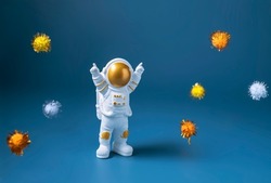 Happy astronaut standing with raised hands