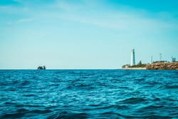 Cape Tarkhankut in summer in sunny weather. lighthouse, sunken ship. Crimea, Russia. tourism, mountains, sea.