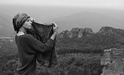 beautiful woman posing on the rocks of Belogradcik in Vidin region, Bulgaria. East Europe, Bulgaria, Belogradcik