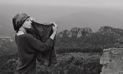 beautiful woman posing on the rocks of Belogradcik in Vidin region, Bulgaria. East Europe, Bulgaria, Belogradcik