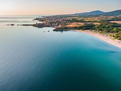Aerial view of beautiful serene beach Koral and Camping Yug on the Black sea in Bulgaria. Camping with trailers near remote beach popular among surfers, beautiful landscape