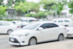 Photo of blurred parking cars in the city