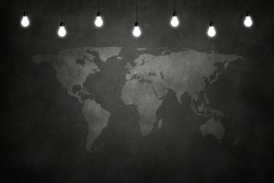 World maps on chalkboard in empty room with bulb lights lamp. Concept business, drawing, ideas
