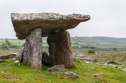 Poulnabrone dolmen, a neolithic portal tomb and a famous tourist attraction in the Burren, County Clare, Ireland - Europe