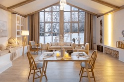 cozy warm home interior of a chic country chalet with a huge panoramic window overlooking the winter forest. open plan, wood decoration, warm colors and a family hearth.
