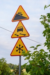 road signs: Yellow slippery road sign, caution road sign steeply, Steep descent sign with car icon and steep grade warning, warning sign 