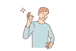Ok sign and gesture language concept. Young smiling man cartoon character standing showing ok sign with fingers looking at camera vector illustration 