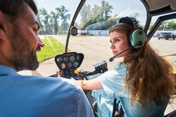 Female student pilot taking aviation lesson with private tutor