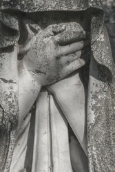 Old White marble statue of woman crying. Despair.