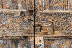 Close up on the lock and handle of an old door.