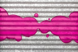 Pink bubbles painted with spray paint on a roller shutter.