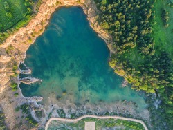 Aerial drone photo of Quarry  turquiose lake colour, open pit mining in Park Grodek, Jaworzno. Poland.