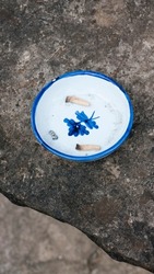 Two cigarette ends in a ceramic ashtray