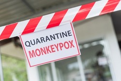 Monkeypox outbreak concept. Message paper and barriers, notice, quarantine to home isolation during monkeypox virus epidemic.