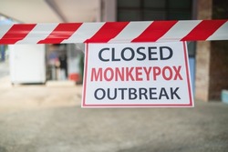 Monkeypox outbreak concept. Message paper and barriers, to closed service during the monkeypox virus outbreak.