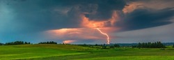 Thunder storm clouds with lightning strikes across the fields, summer, Lithuania