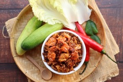 Thai Southern style fried shrimp chili paste - Phuket style chili paste and in Thai called Nam Prik Koong Siep with vegetables at top view