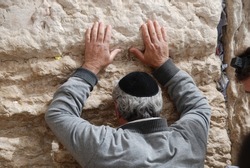 Prayer at the Western Wall A religious man prays at the Western Wall A Jewish man cries and begs praying at the Western Wall A Jewish man prays at a relic to Solomon's temple