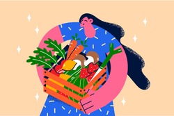 Healthy clean eating and fresh diet concept. Young smiling female standing holding basket of fresh produce veggies greens carrot strawberry potato for healthy eating vector illustration 