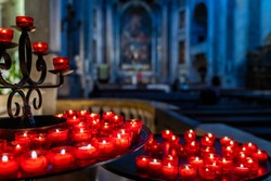 Red Votive Candles in a Church