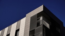 corner of the facade of a modern urban residential building