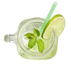 Mason jar glass of lemonade with green lemon slice and mint leaf, honey isolated on a white background, summer drink, fresh, beverage, homemade, cool, fruit juice