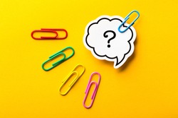 Question Mark Speech Bubble paper is isolated on the yellow background.