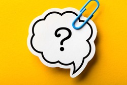 Question Mark Speech Bubble paper is isolated on the yellow background.