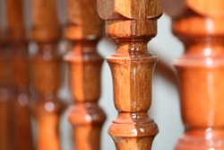 Closeup shot photo of wooden stair railing.