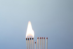 Matchsticks burn, one piece prevents the fire from spreading - the concept of how to stop the coronavirus from spreading: stay at home as #stayathome