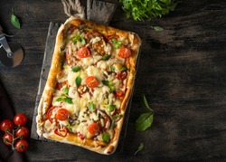 square pizza with tomatoes and cheese