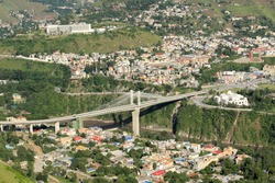 Aerial view of Muzaffarabad City the  largest city of the Pakistani-administered territory of Azad Jammu and Kashmir with Earthquake Memorial Bridge.