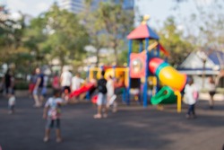 Defocused and blurred image for background of children's playground,activities at public park 