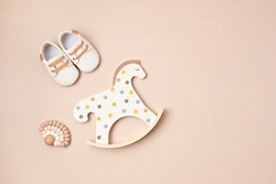Gender neutral baby shoes, rocking horse and teether. Organic newborn fashion, branding, small business idea