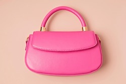 Pastel colored womens hand bag on pink background. Summer fashion concept. Mockup