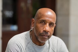 Mature African American man with a concerned look.