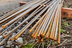 Rebar shot close-up, iron bars, building material, a bunch of metal rods, rust on metal, construction reinforcement. High quality photo