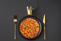 Delicious and tasty  Indian dish with royal black and gold theme.
Chana Masala a favorite dish of every Indian. 