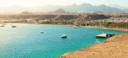 Panorama of Sharm el-Sheikh, Sharm El Maya bay. Red sea and Sinai mountains on a background. Tours to Egypt, travel and tourism concept.