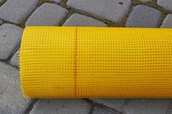 mesh for wall reinforcement,roll of mesh for construction lies on the street