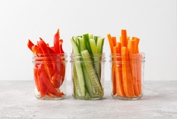 Vegetable sticks in jar. Healthy and diet food concept. Carrot, bell pepper, paprika, cucumber