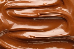 Liquid chocolate paste. Background of chocolate paste. Texture Close up, top view