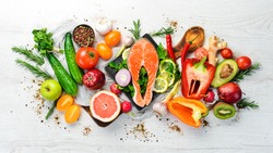 Healthy food menu: fish meat, vegetables and fruits. Diet menu.