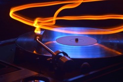 photo in the dark gramophone record vinyl bright sparks and stripes long exposure beautiful bullground for disco music nightclub disc jockey  equipment scratching wallpaper record  vinyl party sound