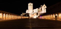 Assisi Basilica by night in Umbria region, Italy. The town is famous for the most important Italian St. Francis Basilica (Basilica di San Francesco)